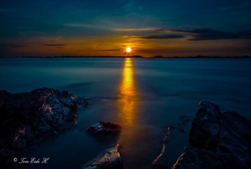 Sunset over Water — Blue, Serene, Photograph, Rocks