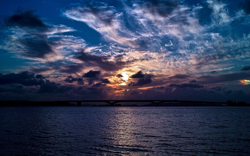 Sunset over Water Bridge — Blue, Dramatic, Photograph, Clouds, Sun