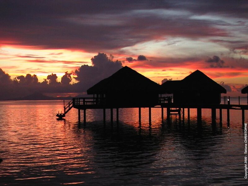 Sunset over water bungalows