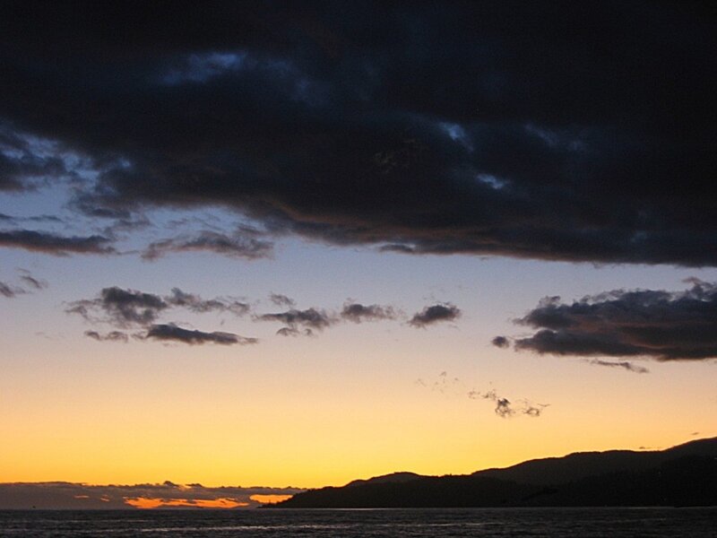 Sunset over Water — Orange, Dramatic, Photograph, Clouds, Mountains, Sea