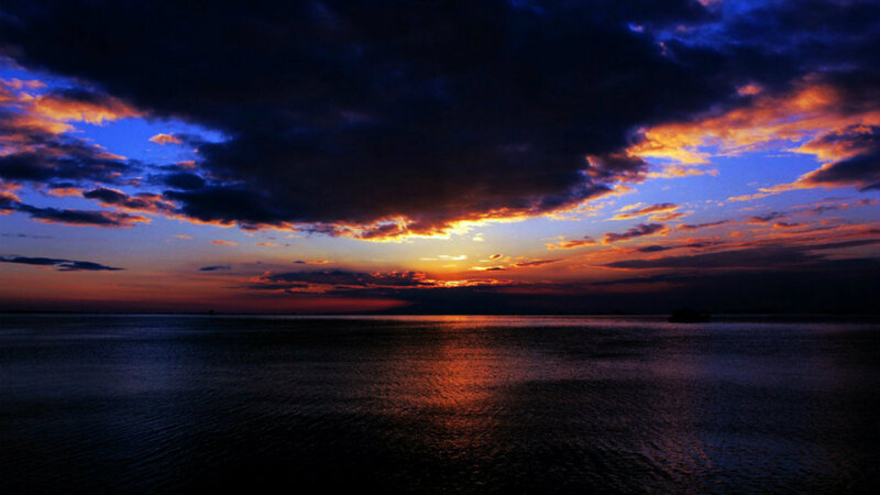 Sunset over Water — Orange, Dramatic, Photograph, Clouds, Sky, Boat
