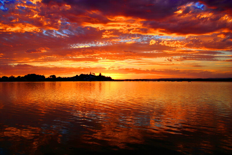 Sunset over Water — Orange, Dramatic, Photograph, Clouds, Sky, Island