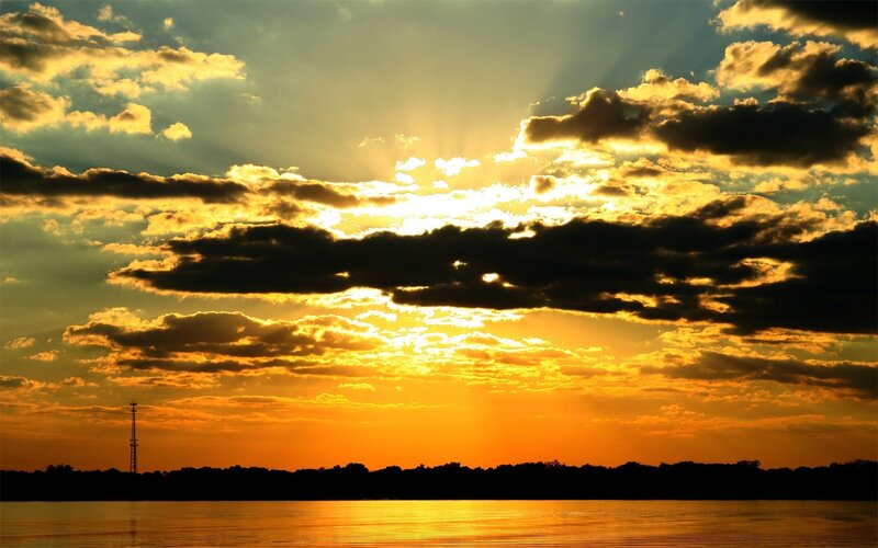 Sunset over Water — Orange, Dramatic, Photograph, Clouds, Sun, Trees