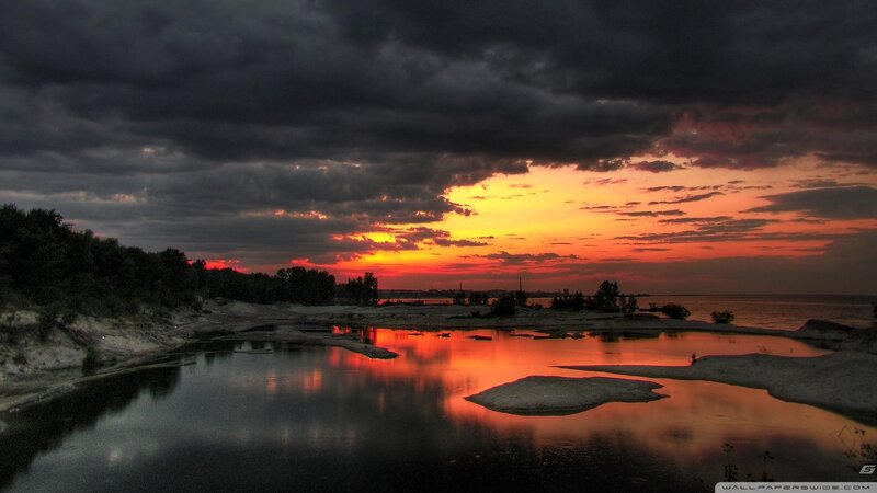 Sunset over Water — Orange, Dramatic, Photograph, Clouds, Trees, Sand