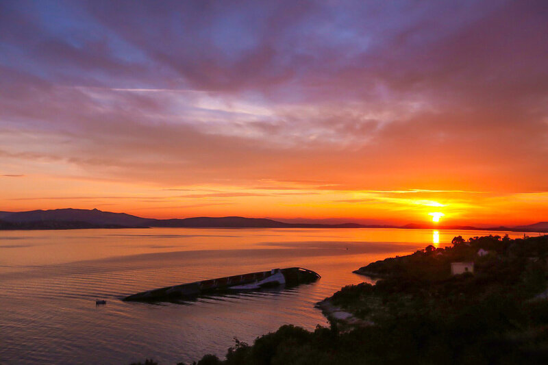Sunset over Water — Orange, Dramatic, Photograph, Mountains, Boat