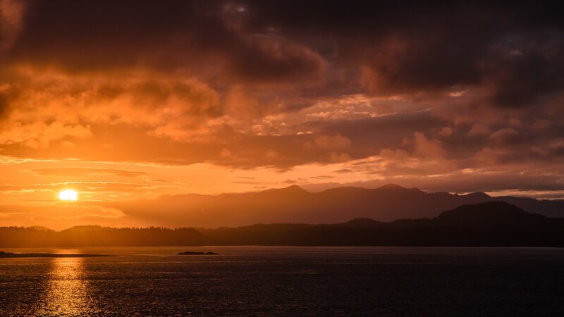 Sunset over Water — Orange, Dramatic, Photograph, Mountains, Clouds, Sun