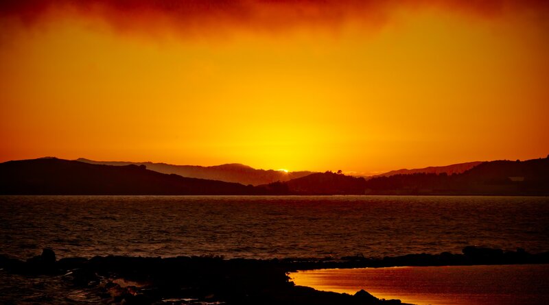 Sunset over Water — Orange, Dramatic, Photograph, Mountains, Sky, Yellow