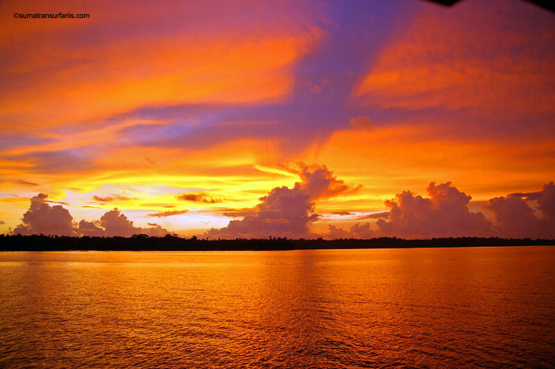 Sunset over Water — Orange, Dramatic, Photograph, Sky, Clouds, Trees