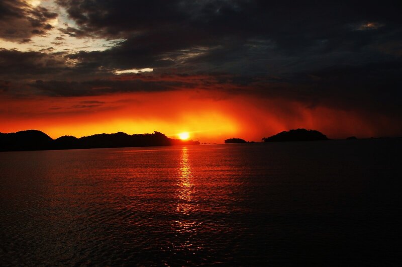 Sunset over Water — Orange, Dramatic, Photograph, Sky, Islands