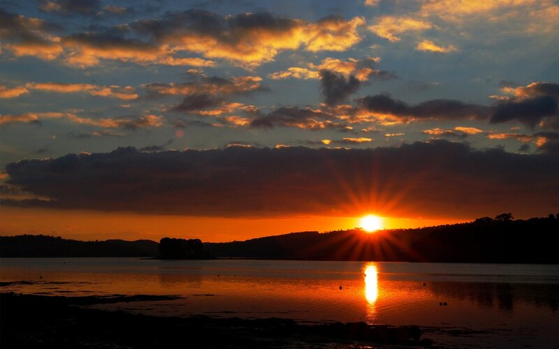 Sunset over Water — Orange, Dramatic, Photograph, Sun, Clouds, Hills