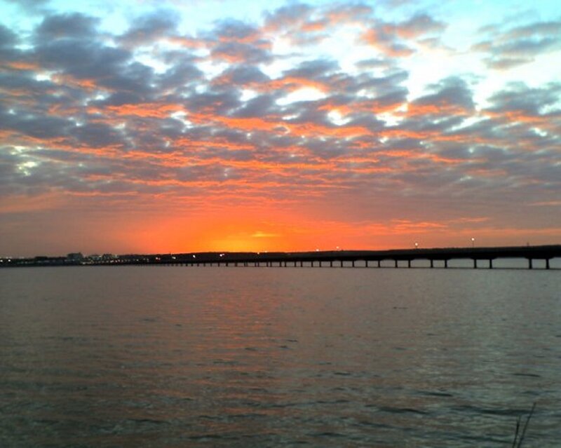 Sunset over Water — Orange, Serene, Photograph, Bridge, Clouds