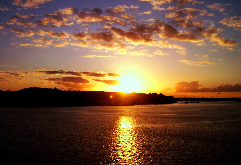 Sunset over Water — Orange, Serene, Photograph, Clouds, Silhouette