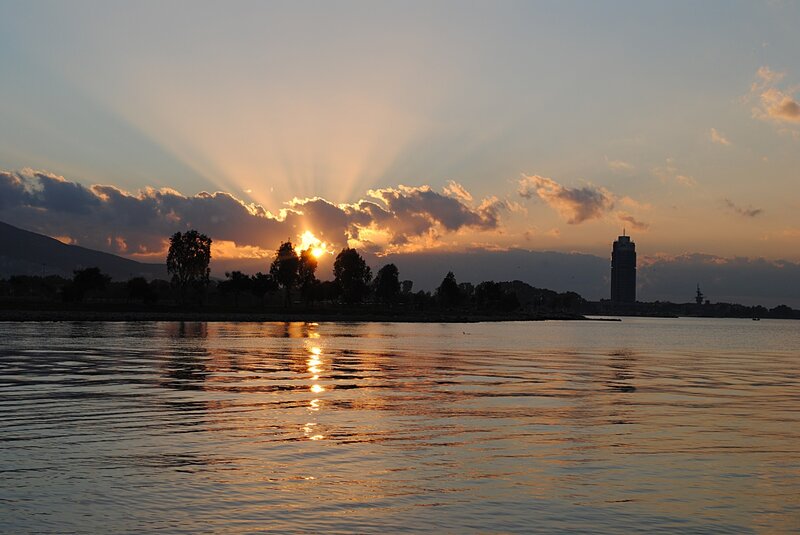 Sunset over Water — Orange, Serene, Photograph, Clouds, Trees