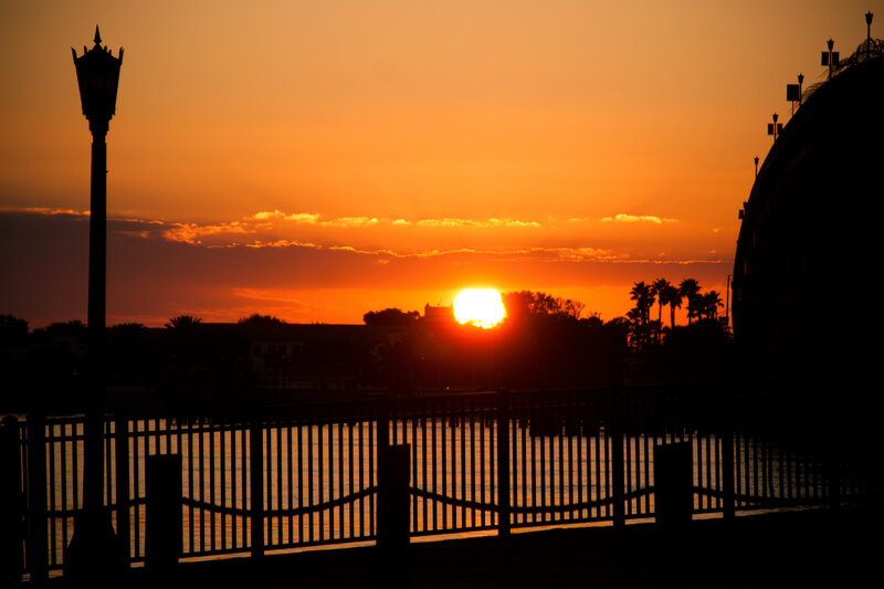 Sunset over Water — Orange, Serene, Photograph, Lamppost