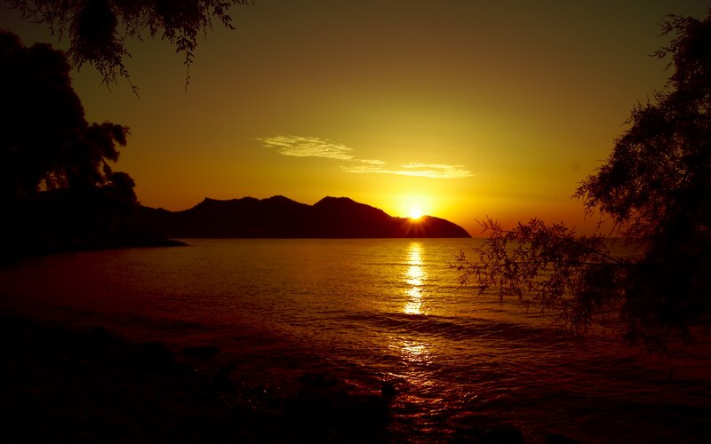 Sunset over Water — Orange, Serene, Photograph, Mountain, Tree