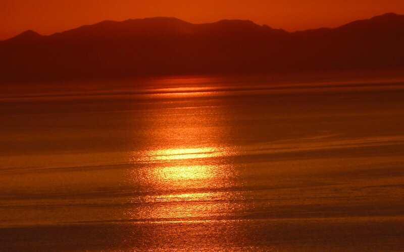 Sunset over Water — Orange, Serene, Photograph, Mountains, Sky