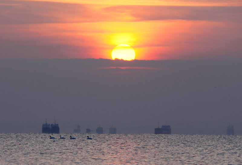 Sunset over Water — Orange, Serene, Photograph, Ships
