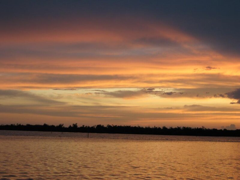 Sunset over Water — Orange, Serene, Photograph, Sky, Trees
