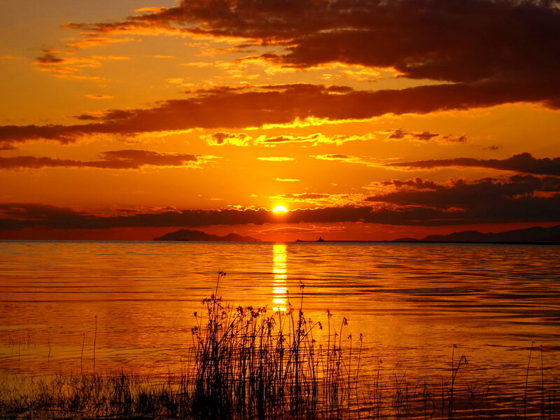 Sunset over Water — Orange, Serene, Photograph, Sun, Clouds, Mountains
