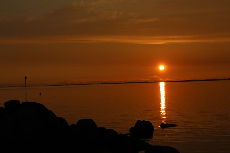 Sunset over Water — Orange, Serene, Photograph, Sun, Rocks