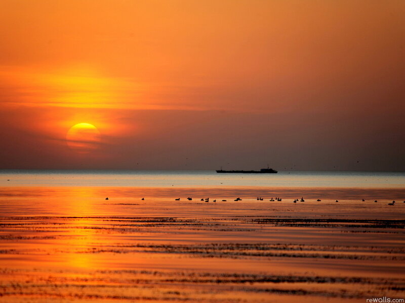 Sunset over Water — Orange, Serene, Photograph, Sun, Ship