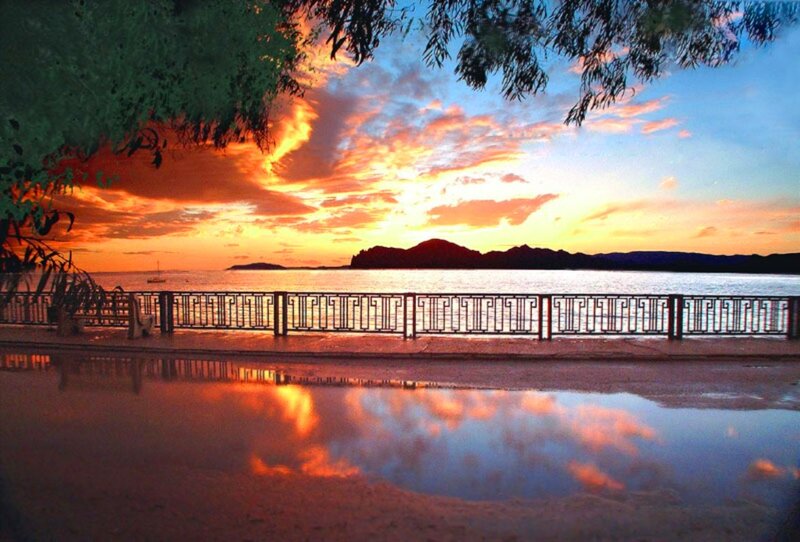 Sunset over Water — Orange, Serene, Photograph, Trees, Railing