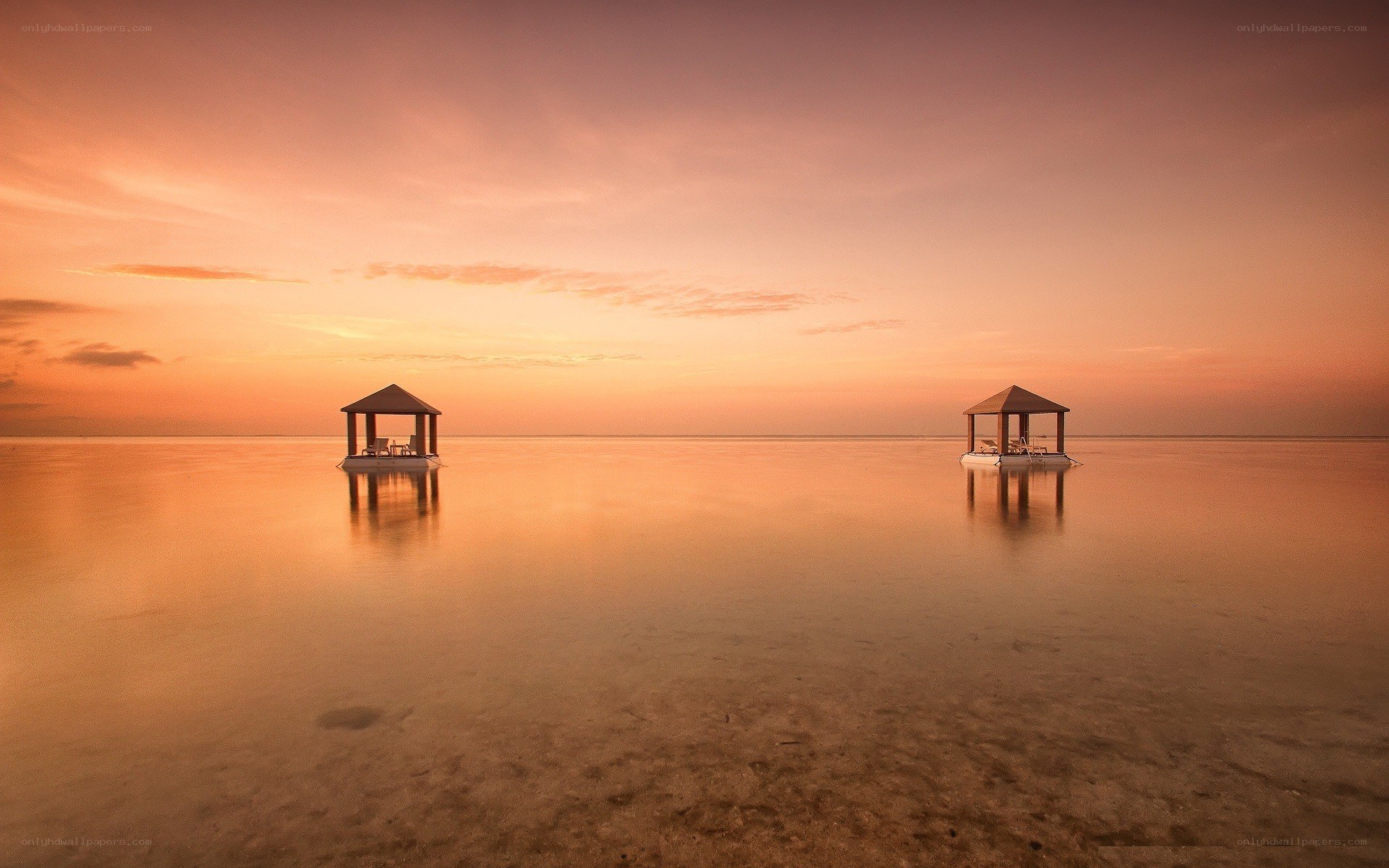 Sunset over water pavilions