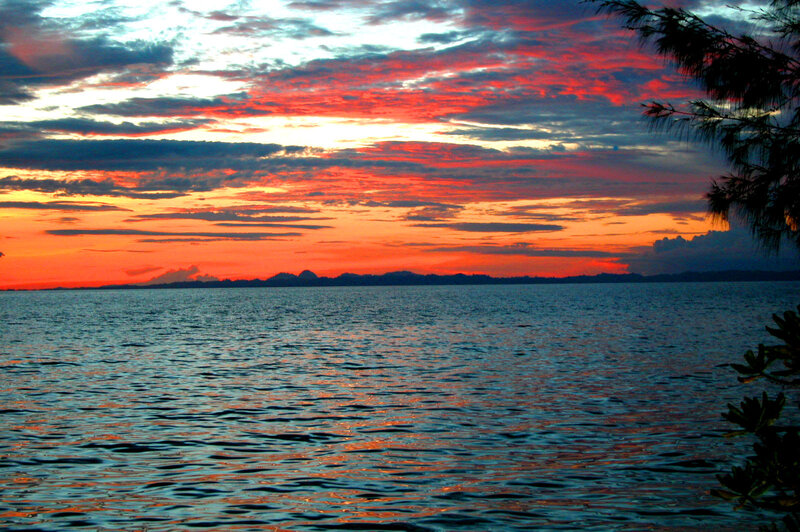 Sunset over Water — Red, Dramatic, Photograph, Clouds, Mountains, Trees