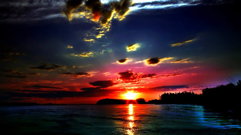 Sunset over Water — Red, Dramatic, Photograph, Clouds, Trees, Sun