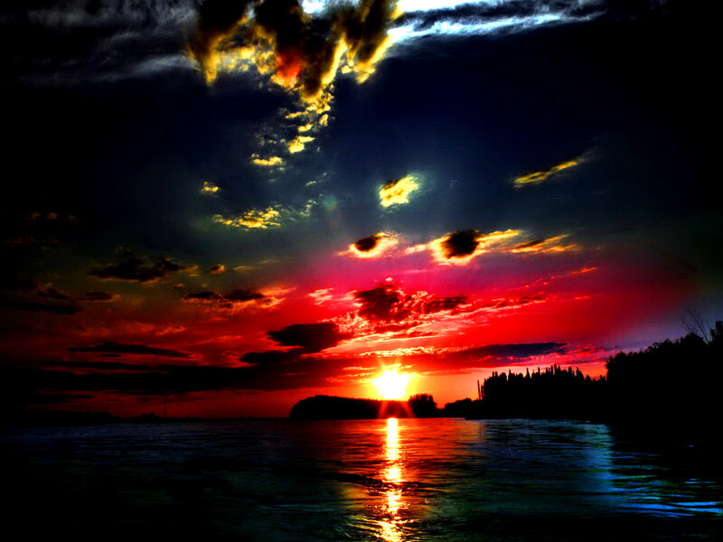 Sunset over Water — Red, Dramatic, Photograph, Clouds, Trees
