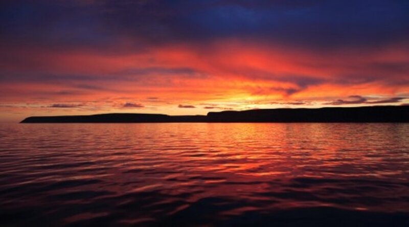 Sunset over Water — Red, Dramatic, Photograph, Sky, Island