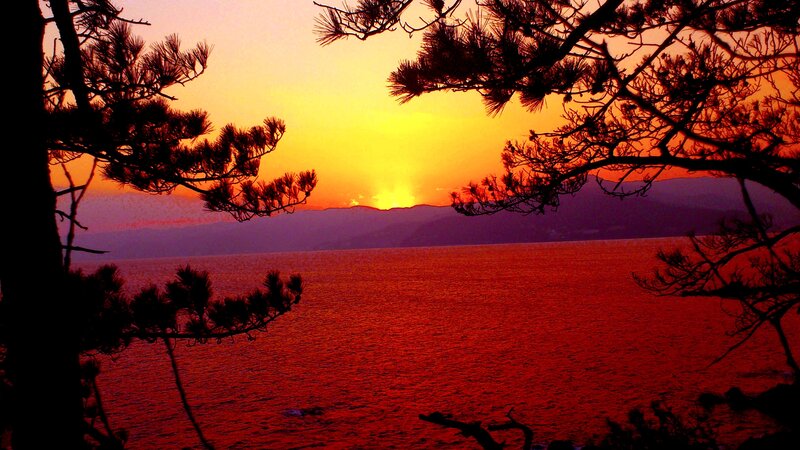 Sunset over Water — Red, Dramatic, Photograph, Trees, Mountains, Sky