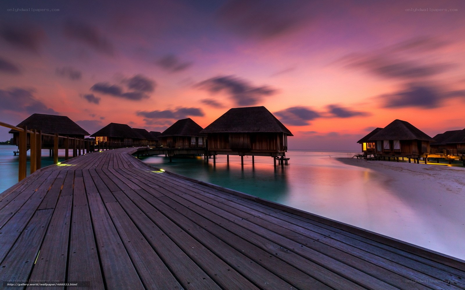 Sunset over water villas