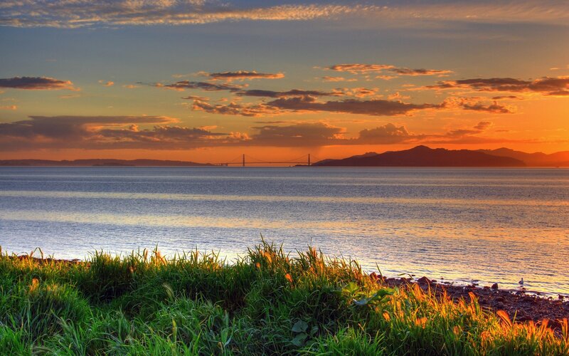 Sunset over Water with Bridge