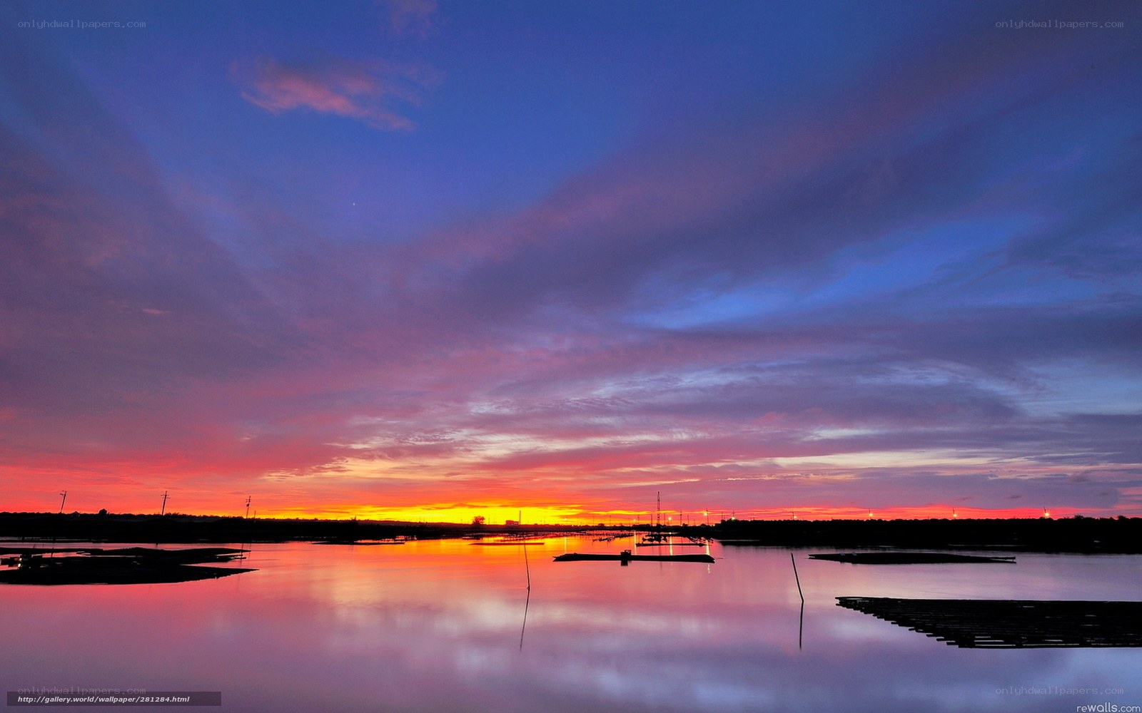 Sunset over water with colorful sky