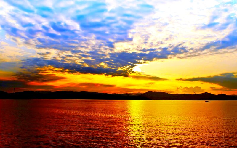 Sunset over Water — Yellow, Dramatic, Photograph, Mountains