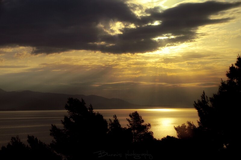 Sunset over Water — Yellow, Dramatic, Photograph, Mountains, Trees