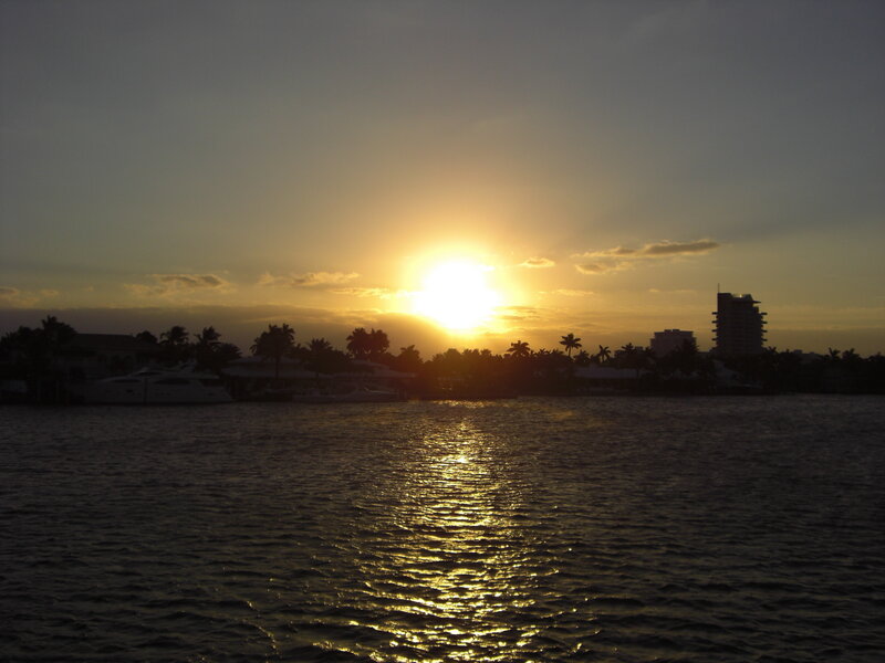 sunset over waterfront homes