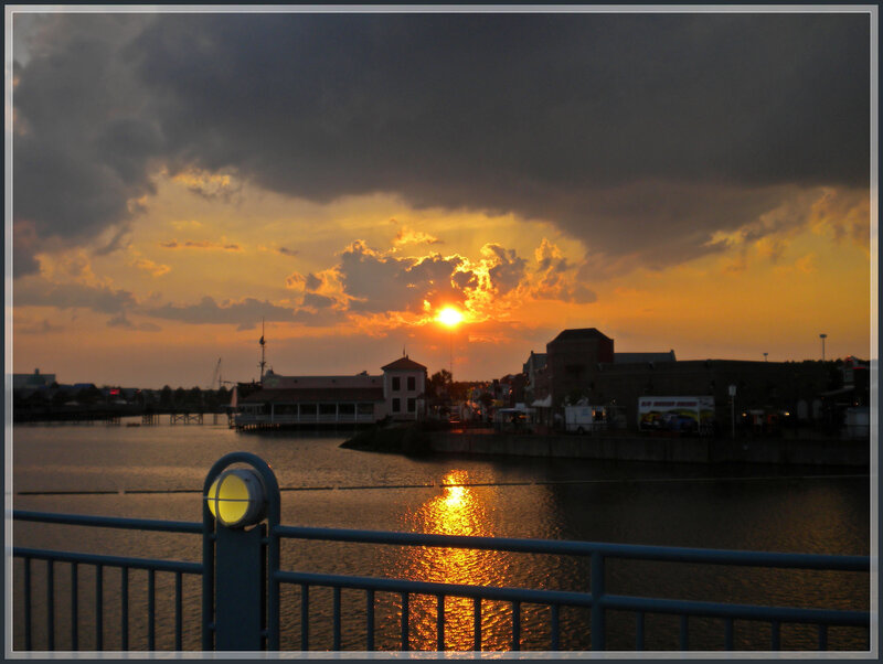 Sunset over Waterfront — Orange, Dramatic, Photograph, Buildings