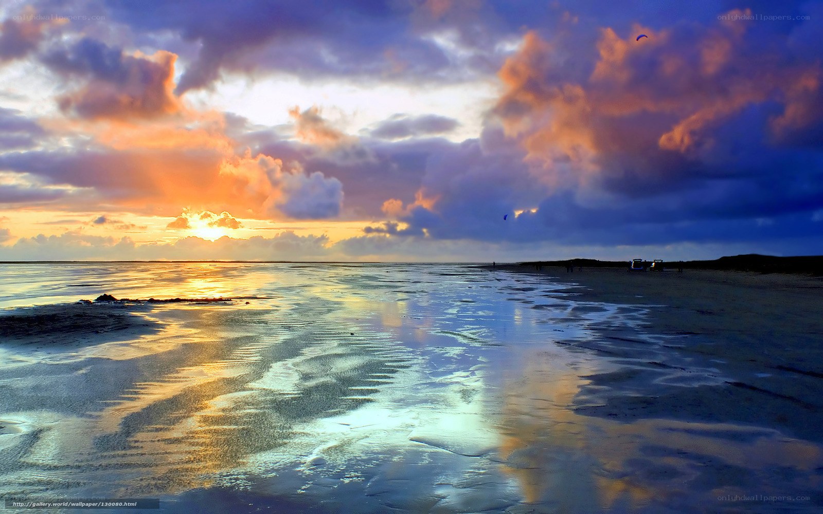 sunset over wet beach
