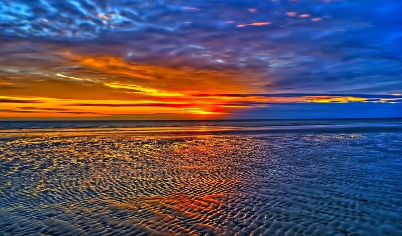 Sunset over Wet Sand — Orange, Dramatic, Photograph