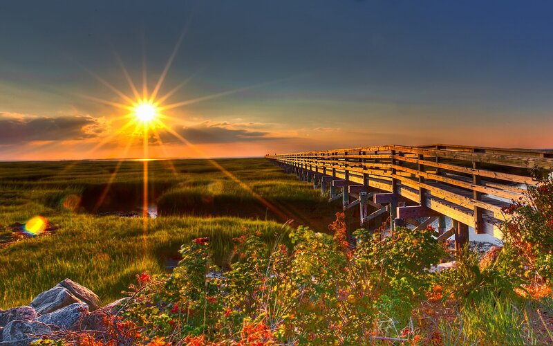 Sunset over wooden boardwalk