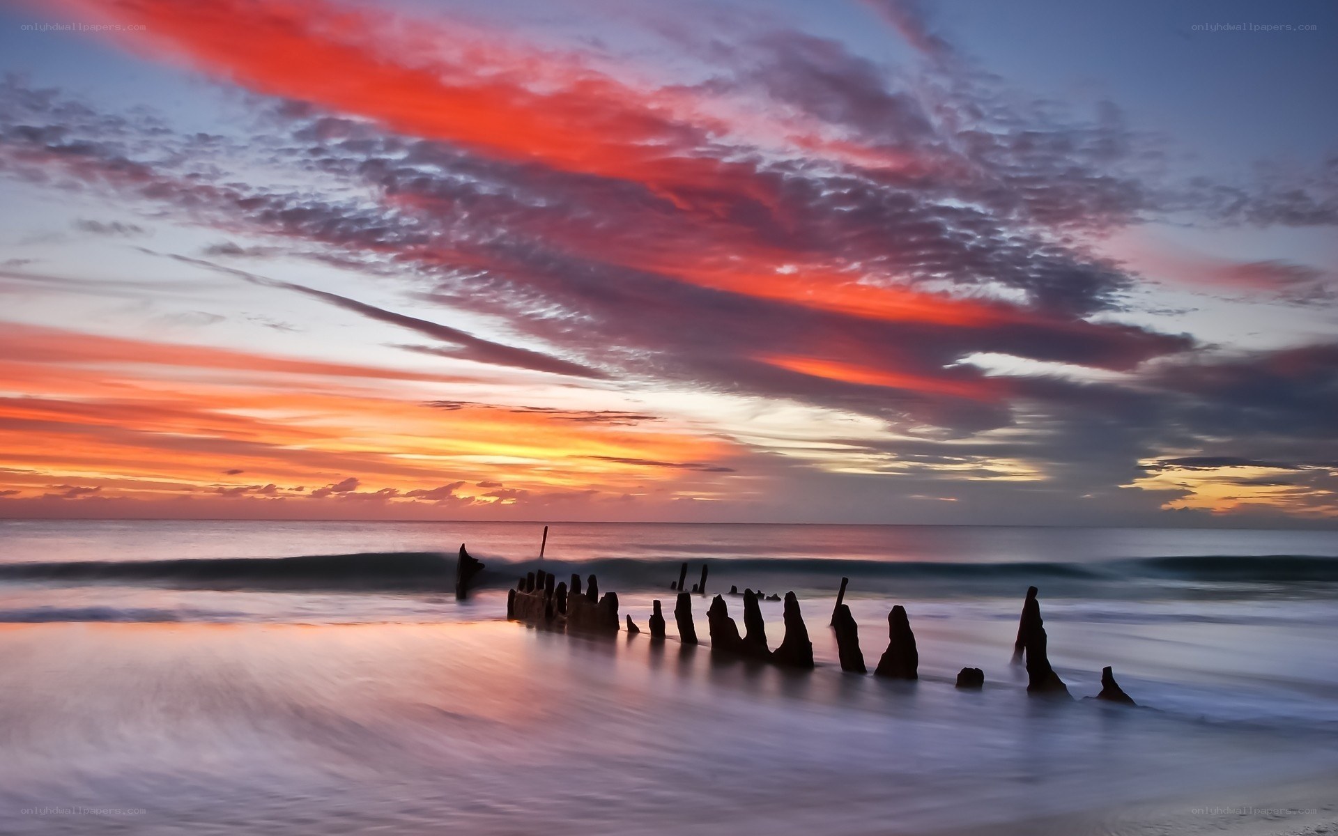 Sunset over wooden pilings
