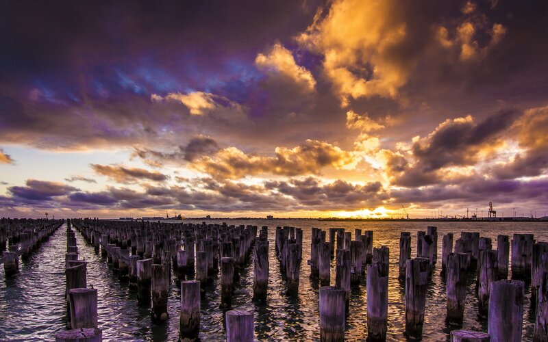 Sunset over wooden pilings