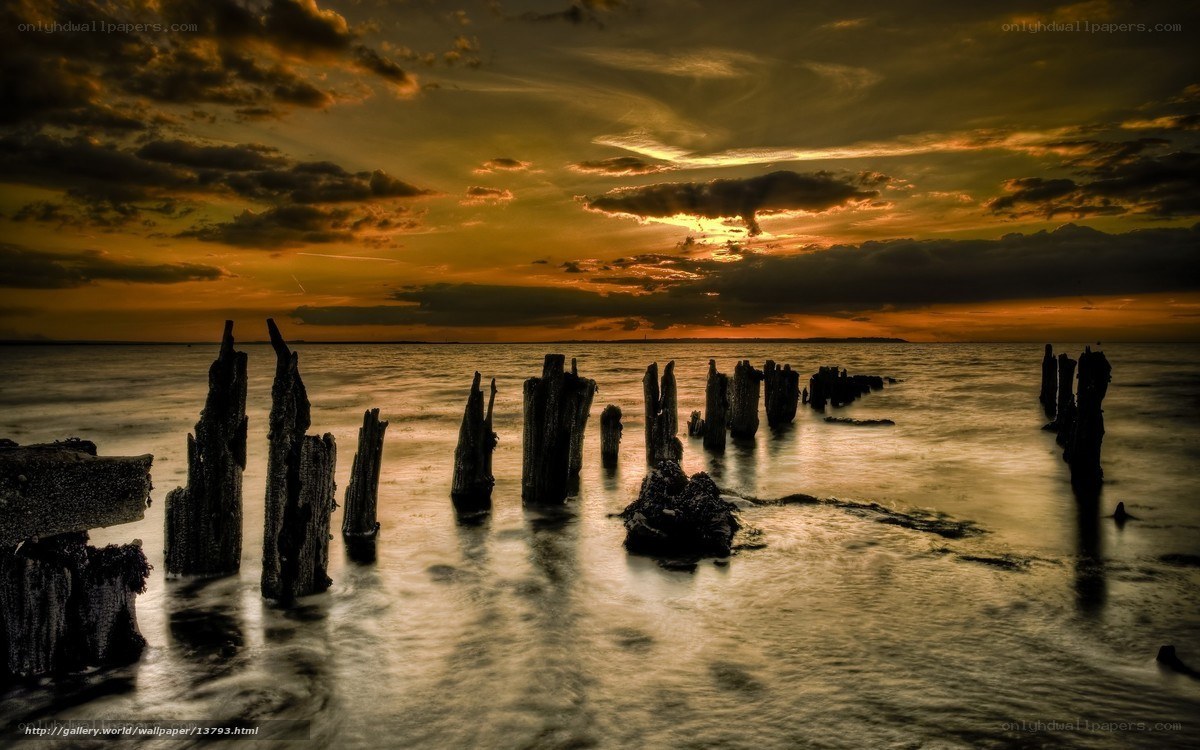 Sunset over wooden pilings