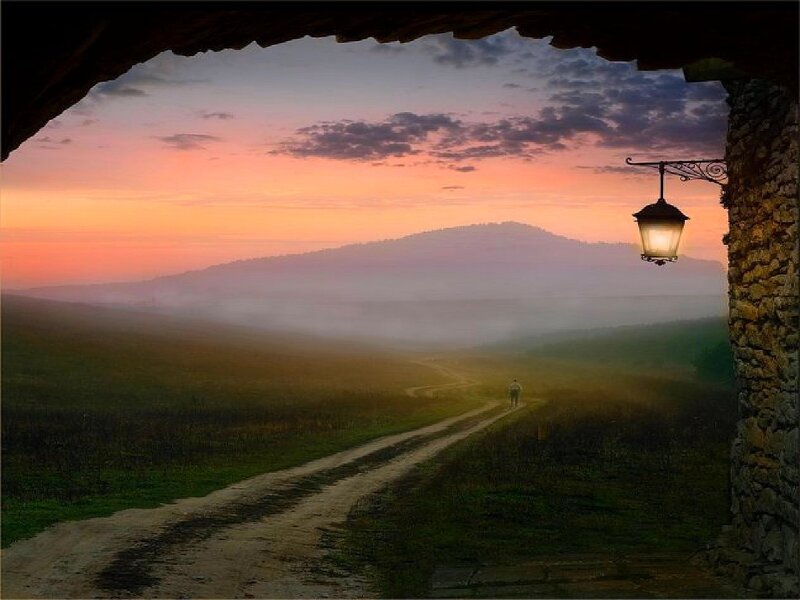 Sunset path through misty hills