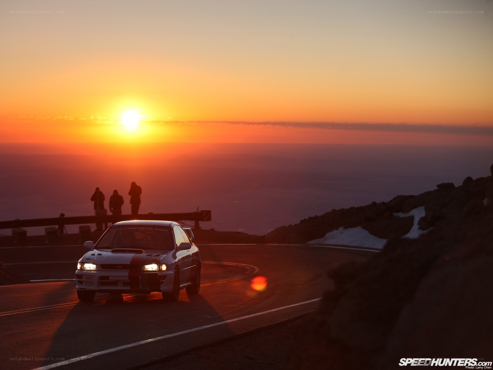 Sunset rally car on mountain road