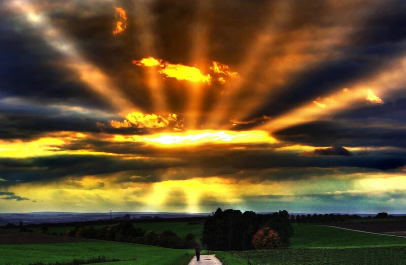 Sunset rays over a rural path