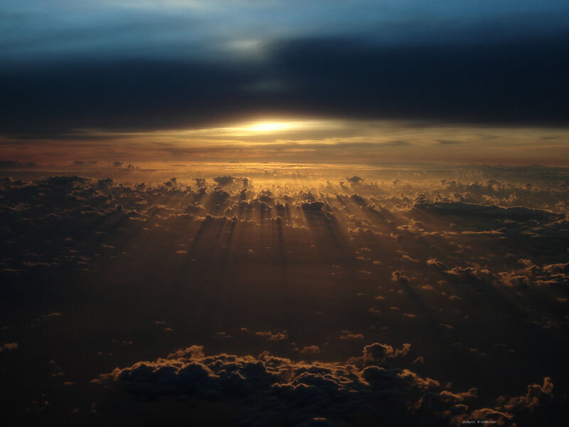 Sunset rays over clouds