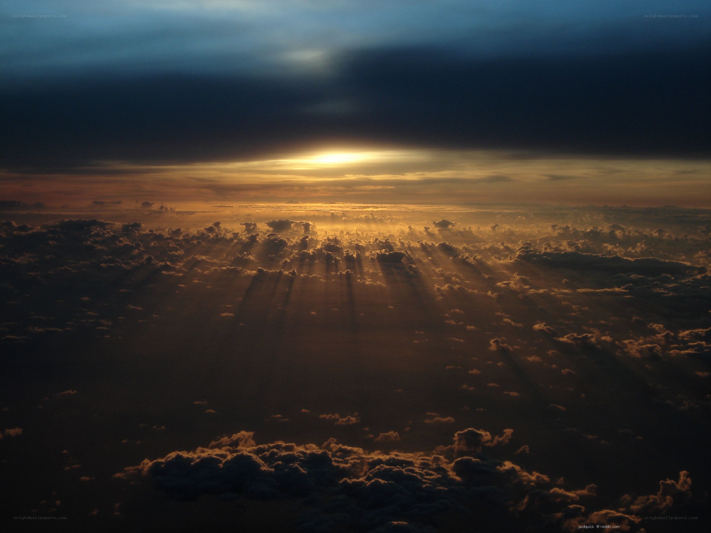 Sunset rays over clouds